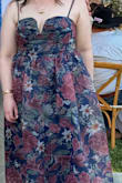 The dress is very pretty. The colors are beautiful. I usually wear an XL and that's what I ordered but the bodice was tight. The inside of the bodice has unfinished seams and because the material is stiff, it is very itchy. - Casey C.