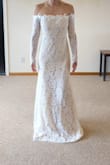 I tried both the small and extra small, but unfortunately it was just much too tight around the tops of my arms so I could barely lift  my arms up. No stretch in the top lace. Beautiful dress, and otherwise fit really well, but I wanted to be able to move and dance more comfortably and returned both. - Leslie W.