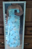 I don't usually go for strapless dresses but this one I love. The zipper is on the side so there's no need to have someone assist you with that. The colors are beautiful, the only thing I wish was a little tighter was the stretchy part in the back. It makes the dress loose on me, so I might have to add straps or more of the adhesive parts so it doesn't fall down, but everywhere else fits well. Also, as a bigger person, sitting in it is an adjustment but it's not the worst. - Greer D.