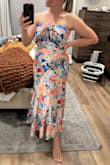 I bought this for a wedding guest dress.
I am 5'5 and about 145lbs and got a M and the fit was true to size!
The color and fabric are beautiful, and overall the quality was very nice.
Definitely need a structured strapless bra underneath because there is no boning.
I am a D/DD and I didn't fully like the way the tie looked across my chest. I think it would have been more flattering on someone with a smaller cup size, but I think that's more of a personal preference thing.
Ultimately the dress was really nice and I could have worn it to the wedding and been satisfied, but I was between this and another dress and the other one was much more flattering and comfortable to me. So I'm returning this one. - Kate B.