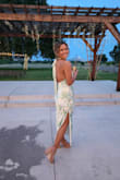 OK first off, I love this dress. I got so many compliments. It literally is just so beautiful, however, it was a little tight on my hip, so it would ride up a little bit. I ended up ordering a medium, and that one was too big, but the small was just a little too small, so I wore the medium. I think it just depends on the kind of fit you're looking for. I am somebody who is in between sizes. - Danielle B.