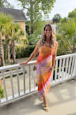 This dress is beautiful and very flattering! I wore it on a night out on a bachelorette trip. Even after dinner and drinking, it was comfortable, and I still felt like it was very flattering in the midsection. There is a little rubber grip on the chest to help hold it up, and it worked really well. I wasn't constantly having to pull it up all night. I highly recommend it! - Megan W.