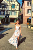 I am so in love with this beautiful dress.  It's romantic, stylish, and makes me feel gorgeous!  The slit is so fun and looks awesome as you walk.  I like that the top will conform to your body because of the lace-up tie in the back and adjustable straps.  The skirt waist has elastic that easily fits to your body as well.  I wore this in France and a woman told me I was "tres chic!" :) - Julie W.