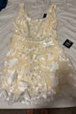 I was so excited to wear this dress for my wedding rehearsal until I opened the dress, and it was literally yellow. I understand the under layer was supposed to be more on the ivory side, but the description online is beyond wrong, and the dress is yellow. - Kaitlyn G.