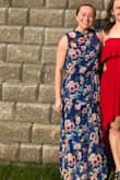 I'm 5'0, fairly petite, more athletic build, and was looking for some wedding guest dress options - it's always challenging given my height. I was concerned the dress would be far too long on me, and although it's supposed to be tea length - it still worked out (and I was pleasantly surprised - I could get away with it). I wore it with 4" heels, but later when it came to dancing - I ditched the heels, and it still looked cute.
I originally ordered XS bc the size finder recommended it, anyway I should have trusted my usual size - I went back for a S instead, and it was a comfier fit. The XS was a bit too tight in the upper body. 
I am also concerned about washing nice dresses. This one says hand wash only, but I don't have time to hand wash always - so I put it on delicate then hung dry, and it's looking good. Also, this dress is nice bc you don't really need to iron it. - Brooke W.