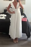 This dress was a different material than I was imagining; it's closer to a linen material, which makes it a tad more casual in person IMO. But overall love this dress and am keeping it. I got a small, and it fits perfecttt but there is zero wiggle room. So if you are debating between sizes, maybe size up? I also feel like it's pretty supportive! I don't have a large cup size, but I feel like even if you do, the straps are fitted enough that it kind of holds you in. Also, zero side boob (for me). Big fan of this dress. Should be super flattering in photos too! - Aspen