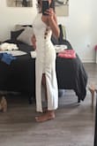 Loved everything about this dress, just returned it because I chose another one. But it fit perfectly. Looks expensive in person and is a great material - doesn't feel thin or cheap. I'm pretty dark/tan right now and wasn't see through at all. - Aspen
