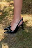 These heels are gorgeous! I love the style, I love the easy slip on strap (no need to undo the clasp every time), and that the heel itself is wider than a stiletto so it's more stable. I wore these for hours and hours in 90 degree heat for my graduation ceremony and had no issues. The soles of my feet were sore after hours of wear, but I rarely wear heels. No blisters at all! I normally wear a 7.5, but bought these in a size 8 and they fit perfectly. Highly recommend these. - Laura H.
