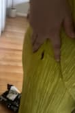 It's just cheaply made. The lining is too small in comparison to the outer fabric, so that the top of the slit pulls and looks weird. On top of that, the seam had a hole in it when I opened it.
Will be returning. - Hannah F.