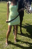I really adored this dress. Very simple and cute. I sized down and got an XS even though I usually get smalls and I'm grateful I did. I wanted the dress to be as close to a snug fit as possible while still being appropriate. I wore this dress to a derby themed event, and it received many compliments. As other reviews have mentioned the dress was a little loose in the strap area. For me, it wasn't horrible. Barely noticeable. However, if I leaned or bent a certain way occasionally the strap would slide down. I just made sure my posture was straighter than average, so it wasn't relevant throughout my night. The material felt great, not cheap. Be careful because it is satin and can snag on your jewelry. Overall, I am happy with this purchase. - Jade S.