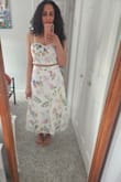 This is so pretty! Had my eye on it for months and snagged it while on sale. So glad I did because it fits really well and the material is cotton and feels great and looks expensive. True size Medium, I can wear a thin strapless bra underneath. - Tithi M.