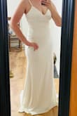 This dress is really beautiful and comfortable. I like the material. It is thicker and has some stretch which is nice. I am 5'9 and it was a little too long for me still (more than floor length). So, I had that altered and got rid of the adjustable straps making it one strap. I also added a belt, and a bustle. The first picture is of the large out of the box on me. It fit me great except it was tighter on my bootie which I didn't want, so I got the XL and altered the top part to be fitting. - Ang A.