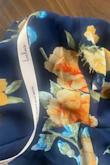 Dress was delivered with a rip on the side near rib area. - Meg H.