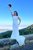 Absolutely obsessed with this dress! I felt so beautiful, elegant, and confident wearing it on my wedding day. The fit was flattering, comfortable, and surprisingly easy to move around in, even survived a short hike to our mountain summit ceremony! The details photographed beautifully, and I received so many compliments all day long. It made me feel sexy, classy, and magical at the same time. One of the best purchases I've ever made! - Lizabeth C.