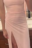 The fit is good when standing, but when I sat down, the slit was fully open, crotch out. I sized up, which helped a little, but definitely won't be able to get down on the dance floor, it's a lot of thigh. The cross over lay also is see through. - Skylar D.