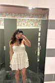 I love this dress. It is super cute and worked well for graduation. The only thing is that I ordered a size medium, and since it is strapless, it was a little loose at the top and on my waist. I did stick with the size though because I was unsure if a small would be too tight or uncomfortable. It is also short so be mindful of that. Overall, I love it and will definitely wear again! - Rachel G.