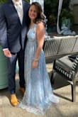 The dress is stunning, and the material is really nice. Unfortunately, even with heels, this dress is just way too long for the short girlies. I am 5'2" and I think this dress would be much better on any 5'5" or taller! - Annie C.