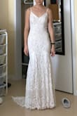 I bought this dress as a possible wedding dress. I really loved the train and the length was perfect with 3" heels. The fit was perfect too. However I did not like the seam on skirt and the top was a little lackluster. I wanted to love it but it just didn't work out. - Wendan L.