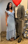Absolutely loved this dress! The soft blue color is beautiful and flattering, and the ruffle details give it such an elegant, feminine touch. It fit perfectly, was comfortable all day, and photographed amazingly. I received so many compliments and felt confident wearing it. - Antonio R.