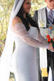 I was completely in love with this dress!! My wedding was small, so I didn't want a regular wedding dress but I still wanted something that would clearly yell "I'm the bride", and this was it! The sleeves ran a little big on me but they weren't falling off my shoulders or anything like that. The material felt so comfortable on my skin, it wasn't itchy and didn't feel cheap. I usually wear a medium but based on my measurements (which I took before buying the dress) I was recommended a large. It fit like a glove! Overall, for the price, I couldn't have asked for a better dress. It was classy, comfortable, and a very good purchase. - Maria G.