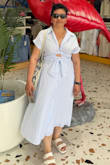 Fabric is soft, washed and keeps its shape. This is my favorite black summer dress. I feel confident and stylish, but mostly very comfortable walking around, loved the shape so much. I bought the white and blue striped one also. Took on a cruise to the Bahamas and the fabric kept me cool, while the length protected my legs from the sun. But I was still able to enjoy the ocean on the water's edge. Belt was able to cross and tie in the back or front. - Sofia M.