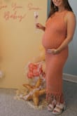 I ordered this for my "under the sea" themed baby shower, and it was perfect! It was the perfect mermaid vibe, and I got so many compliments! I'm typically an XS in Lulus dresses, so that's what I ordered even while pregnant. I'm 8 months pregnant, and there was plenty of stretch. I'm 5'0 and the length was perfect (although if I didn't have a baby bump, it would probably be a bit longer). The beads do make a little noise when you walk, and the dress has a little weight to it. But overall, I absolutely loved this dress! - Laura T.