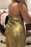 This dress is made for someone with a long torso. The back zipper is very long and required tailoring. - Kenyatta S.