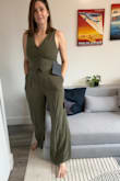 This material is gorgeous and I love the matching trousers - makes for such a great outfit. However, I had to return the medium I ordered - the fit was great everywhere except over the bust. It gave me quad boob and I was worried the buttons wouldn't be able to hang on. I got a large and could have even gone XL and they both would have fit. It does shrink a little in the wash (I know it's hand wash but that's just not always realistic for me so I wash on cold gentle cycle with no spin and steam it after it's dried). If you're large busted or are unsure of sizing, go up! - Emily P.