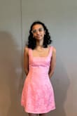 It fit perfectly, while initially I thought it was a little loose on my chest, the back does allow you to tighten it when your tying it which helped a lot. I wore it for a banquet and got so many compliments, the pink wasn't as extreme as I thought and complimented my skin tone pretty nicely, and I like that its not too short. I wish they kept it a little more stocked as its super popular and I would love to buy it in white for graduation. - Althea F.