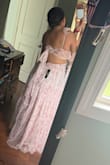 This was a beautiful dress. It true to size. I ordered a large and I'm a bit busty on top. It's comfortable too. - Ashley A.