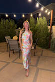 I love the fabric and pattern. Form fitted enough to show curves but not too tight. Silky fabric but second layer to prevent it from showing lines. Super cute with the halter detail and perfect length! Wore it for a nice dinner out. - Erica W.