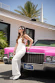 I absolutely loved this jumpsuit. I wore it for my wedding and it was the best decision. I was pleasantly surprised by the quality of the material and also by how comfortable it was. The sizing does match the measurements provided. The only small issue was that the pants were too long for me, so I had to hem them since I'm 5'1", but everything else was perfect. A really great purchase. - Valentina O.