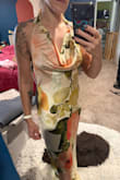 The material is see through. The top half inside has the same patterned material as a liner but the fabric is so thin, you can see the pattern showing through. It also runs large. I know it's not supposed to be fitted, but I usually wear a Lulus small and the XS was still pretty loose. Decided to return because of the fabric but style wasn't quite me. - Carmen C.