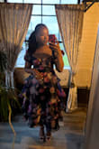Beautiful dress. Made very well and feels like it was made with quality materials.  The zipper did give a little issue getting up because the liner kept getting stuck in it, but I had help, and it worked out. Got many compliments. - Mekhima L.