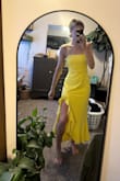 This dress is gorgeous, and once I get it altered, it'll fit like a glove. But the color is a much brighter yellow than what's imaged. - KATE M.