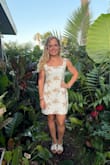 This dress is so cute! Fits me well, a little baggy in the middle, but the small I think would be too tight. The fabric doesn't stretch. It can be dressed up or more casual. It does wrinkle easily but steams out easily. - Brittney H.