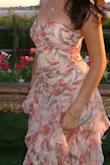 Everyone LOVED the dress. It does run big, in my opinion, and I did have it taken in. I would size down one size. The colors are beautiful, the design I beautiful. Just love it. - Selina S.