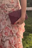 I fit my phone, 2 lip glosses, a fragrance oil, slim wallet, a card, a pair of socks, and a pack of tissues and had room to spare. Gorgeous pattern. Gorgeous color. The dress I'm wearing is from Lulus too! - Selina S.