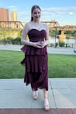 I got so many compliments on this dress at a recent wedding! The flowy material was great for an outdoor summer evening. I'm always a bit hesitant going for strapless dresses as I'm concerned that the dress will fall down throughout the night, but this stayed up with no issue (including during lots of dancing). Has a little bit of stretch without looking cheap like some dresses with built-in stretch can. Fits true to size, color is accurate to the photo, and I was surprised at how comfortable I was all night. Highly recommend! - Jaime K.
