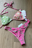 Bikini top and bottoms are not reversible. The print does not match the photos shared. The bottoms had two separate, not related prints as well. - Maxene H.