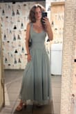 I absolutely loved wearing this dress at a wedding I recently attended! I got lots of compliment, even from a gal working at the bar after the reception who wanted to wear the same thing to an upcoming wedding! As a petite girly, I do think that the straps are a little long. If I had more time I would have gotten it altered, but a quick pinning in the back did the trick for the night. It's also maybe a bit long even with heels, which just makes it feel more formal. Overall though, 10/10 would recommend! - Lindsey H.