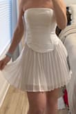Love love love! Got this for my bachelorette trip. Shows off the curves beautifully and isn't too short but I think would need under shorts or a slip since the pleated skirt is a little see through. The corset is a little smaller on me so I probably should have sized up to a medium but it's perfect. Ties in the back with thicker string so I'm not worried about a rip! Scarf is so cute! - Leah S.