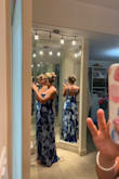 I loved the fit of this dress. I did not need to hem it at all; the tie straps made it adjustable. It fits snug but not too tight. I love the fold at the top of the dress. It was perfect for the garden theme wedding I was attending. Even though I was sweating, the color and design hid my sweat fairly well. The only thing I did not like was that the zipper on the back had a bump in certain places. Almost like there was too much zipper for the amount of dress. It was not extremely noticeable, though. I got so many compliments and will be wearing again. - Kenzie D.