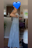 The dress is so soft and flows amazingly. It hugs my body - the top part is snug though. Not so tight that I can't sit or breathe, just enough that it is tight so it looks like it's snatched. My under bust is about 30" and 25" waist. The back is stretchy, so I'm sure it can give or take a few inches. I got 2 colors to try and decided to keep both. - Feipu S.