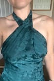 Very disappointed in the fit of this dress and the overall quality. The zipper isn't even with the dress and sticks out like a sore thumb. It is tight in the waist and does just naturally fall, so it rides up a bit. The neck is about 3 inches too long, and the side of the dress leaves you completely exposed in the boob area. I had so much extra fabric I could twist the neck, and that finally made it snug enough where the boobs weren't coming out the sides. I used the sizing tool on the site, and it suggested a size small - that's what I purchased. Even while wearing 3.5 inch high heels, I will have to hem it at least 2-3 more inches just for it to be floor length and not trip over it. I don't even know if making all of these extra accommodations is worth it. - Ashley P.