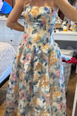 I loooove this dress and I did decide to keep it! I normally wear a size small, but it was so big it was falling off of me. So I ordered an extra small and it's a little too snug, but not enough that I can't wear it. The colors are beautiful. The shape of the dress is waist-snatching but also flowy below the hips. My only complaint is that I wish the sizing was a little more accurate. Then I'd give 5 stars! - Kelly P.