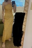 I bought this dress for a summer wedding rehearsal. I'm 5'4 and the dress is longer on me than the model in the photo. I'd like it to be a little shorter but I'm not gonna spend the money to hem it. The dress is like gauzy material. The dress bunches a little around the waist, but if you tie it right, it fits fine enough! I'm wearing a sticky strapless bra and I don't know if it's worth $55 (with a discount) but I'll keep it. As you can see, it's thin material. I'll need to wear nude underwear. The dress should be light for the heat. It's an okay dress. - Aidan H.