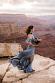 I chose this dress for my engagement photo shoot at the Grand Canyon and it was beautiful! It's some-what heavy and the material is not breathable (don't wear this in the middle of summer!), but it flows like no other! It is pretty long, but I didn't want to get it hemmed for the shoot. I got so many compliments on it! - Alex V.
