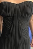 This dress was everything I was looking for, but when it arrived, I was extremely disappointed. The dress I received, has a large rip on the inside of the back. Given the way it fits, I am assuming the person who tried it on prior to me purchasing it, had an issue zipping it. I am tall and slender and when I zip the dress, the material bunches in the back and the zipper is not straight. The pleats on the front don't match. The dress is on the longer side. With 3" heels, it will be okay, but even with heels, it's still on the long side (even for a tall girl). The dress bunches under the bust. - Tina D.