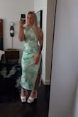 I absolutely loved this dress. At first I ordered a medium for fear of the small being too small. The medium was not curve friendly and the back scoop was not tight against my body. I was in a crunch to get a dress for the wedding. I wasn't sure if ordering the same dress again was the best answer because I didn't really like it. I ended up ordering the small and getting it in just in time and absolutely loving it. The color was amazing. Everything was awesome. The wedding was on an 86° day and the high neck was awesome with a high ponytail. I couldn't have been more comfortable!! - Kerissa R.